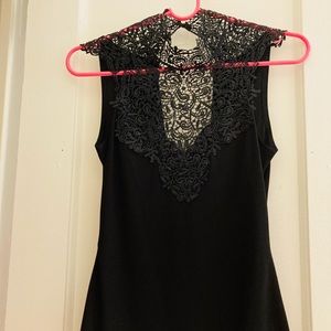 Cute blouse with detailed neckline, gold clasp